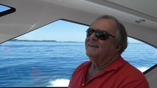 Max Hume at ease at the helm of his Riviera 4000 Offshore, Blase. © Riviera . http://www.riviera.com.au